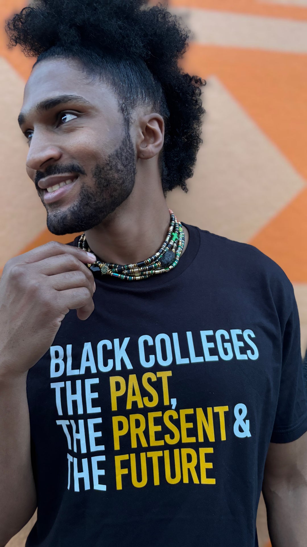 Close-up of gold text on black HBCU shirt Black Colleges the past the present the future design